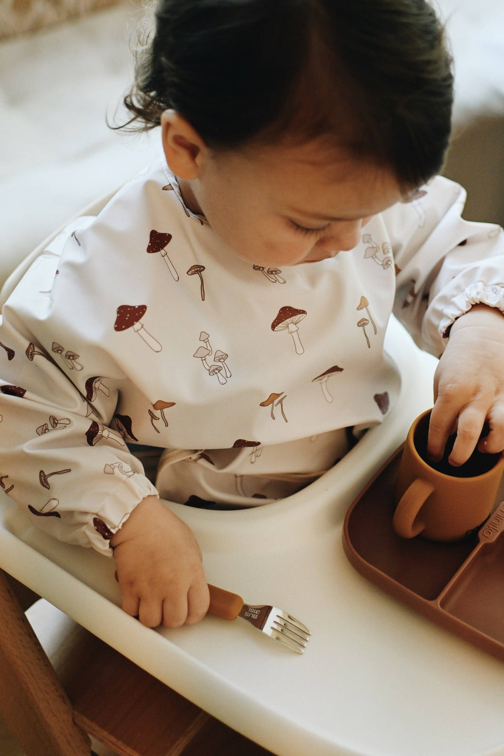 NR MINIKA LONG SLEEVE BIB | MUSHROOMS