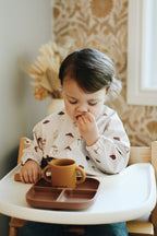 NR MINIKA LONG SLEEVE BIB | MUSHROOMS