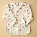 NR MINIKA LONG SLEEVE BIB | MUSHROOMS