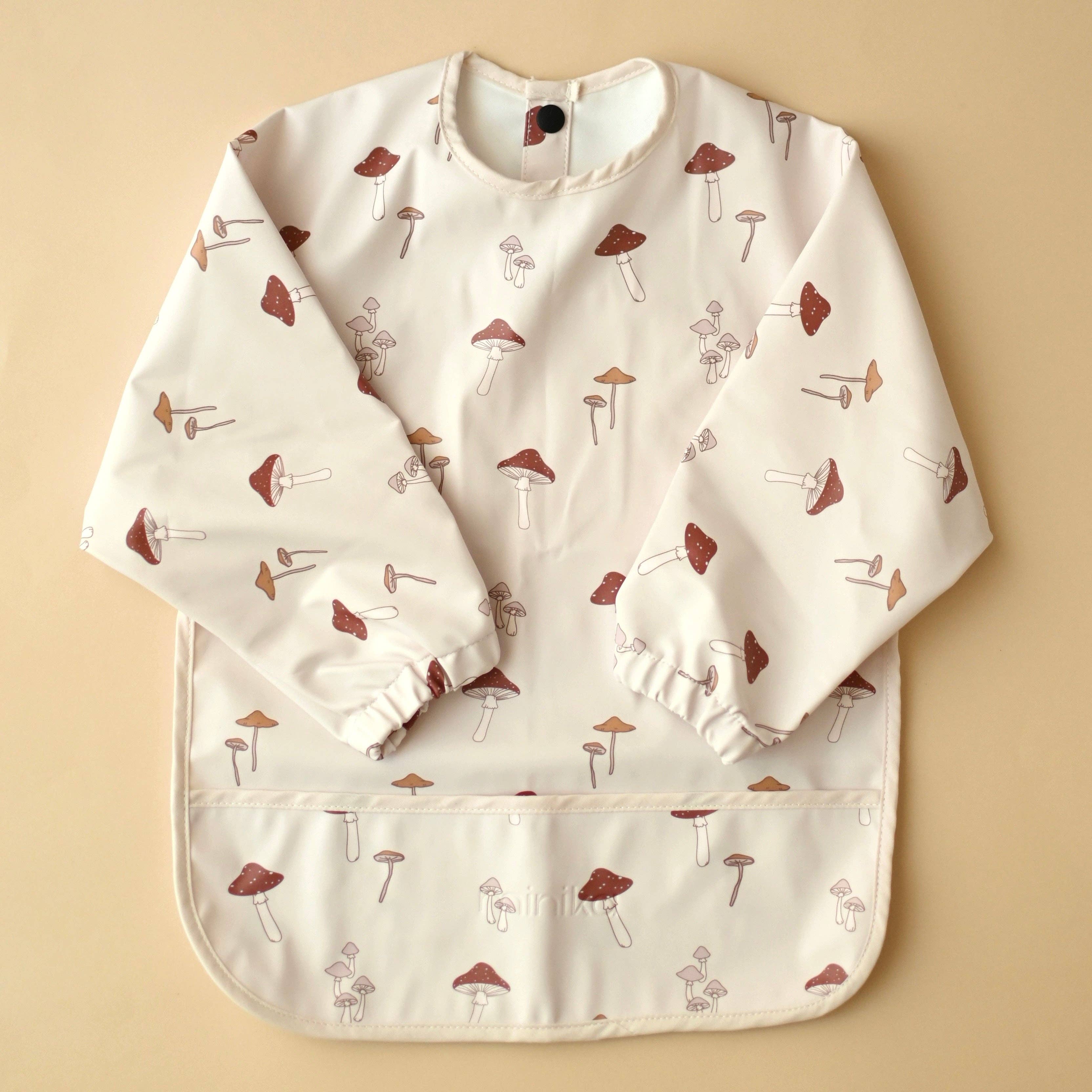 NR MINIKA LONG SLEEVE BIB | MUSHROOMS